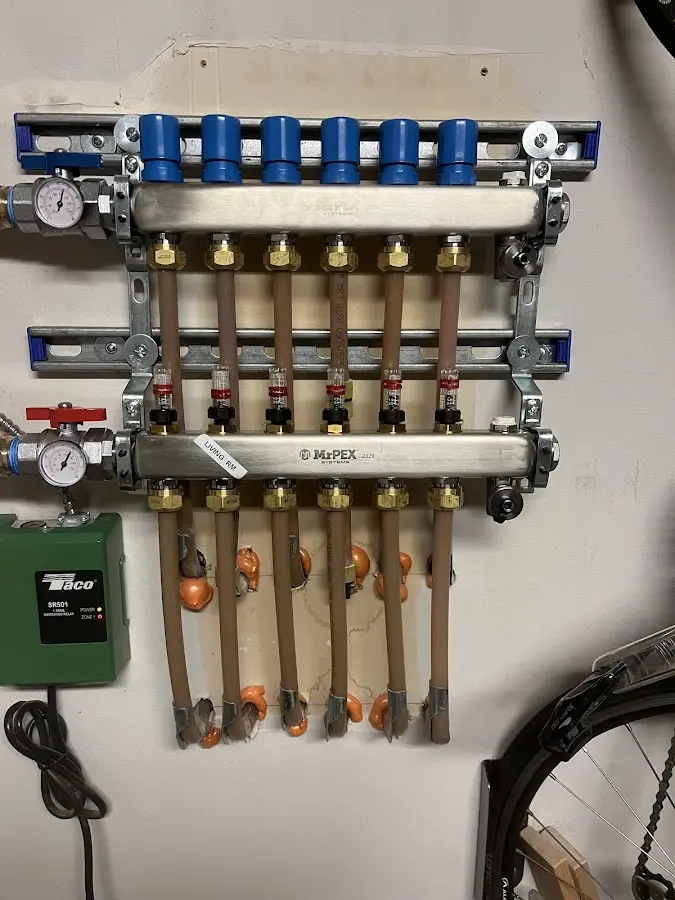 Plumber performing Water Heater Repair at a residential property in Logan